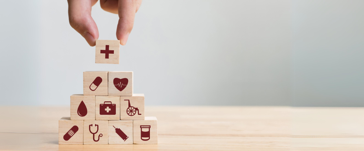 Hand arranging wood block stacking with icon healthcare medical