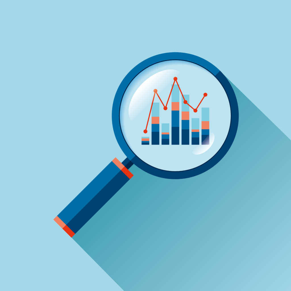 Magnifying glass with a bar and line graph on a light blue background