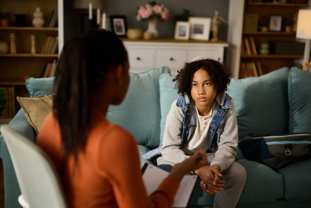 Teenage boy in counseling session at the psychologist