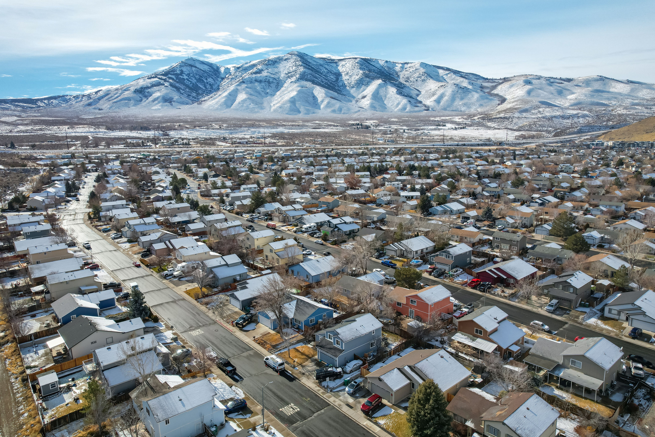 Reno, United States – January 04, 2025: The development of Reno's North Valleys area stands on display with a snow covered Peavine Mountain rising from the background.