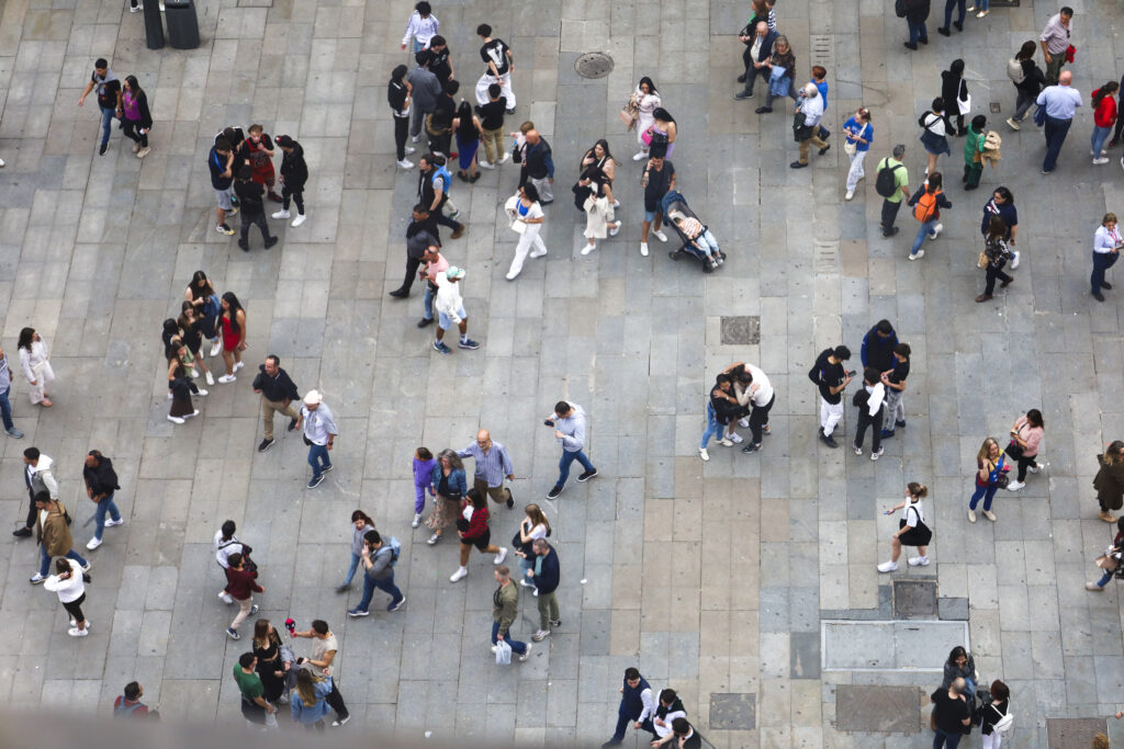 Aerial view of people walking in Madrid city.