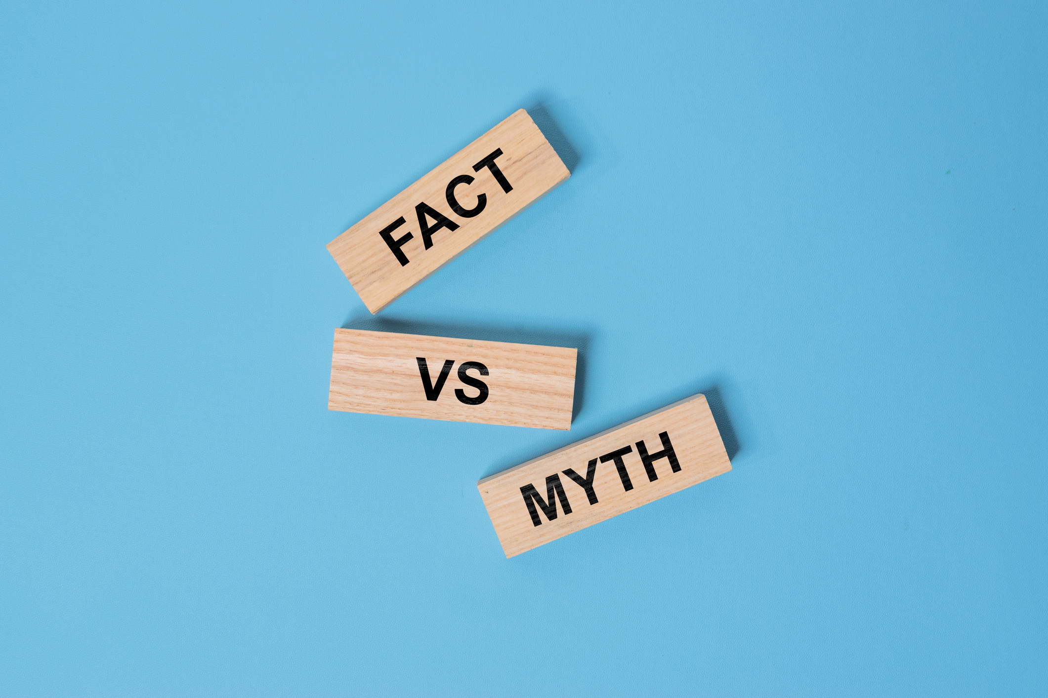 Fact vs myth symbol. Concept words Fact vs myth on wooden blocks on a beautiful black table black background. Business, finacial and fact vs myth concept.
